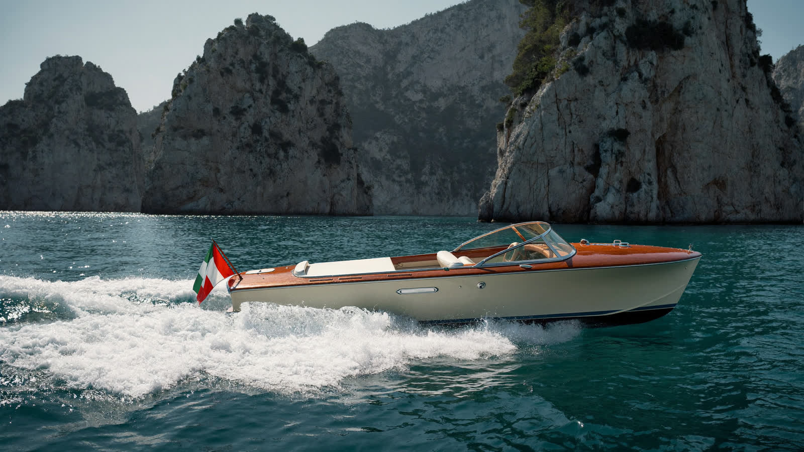 A classic wooden motor launch off the Li Galli islets near Positano