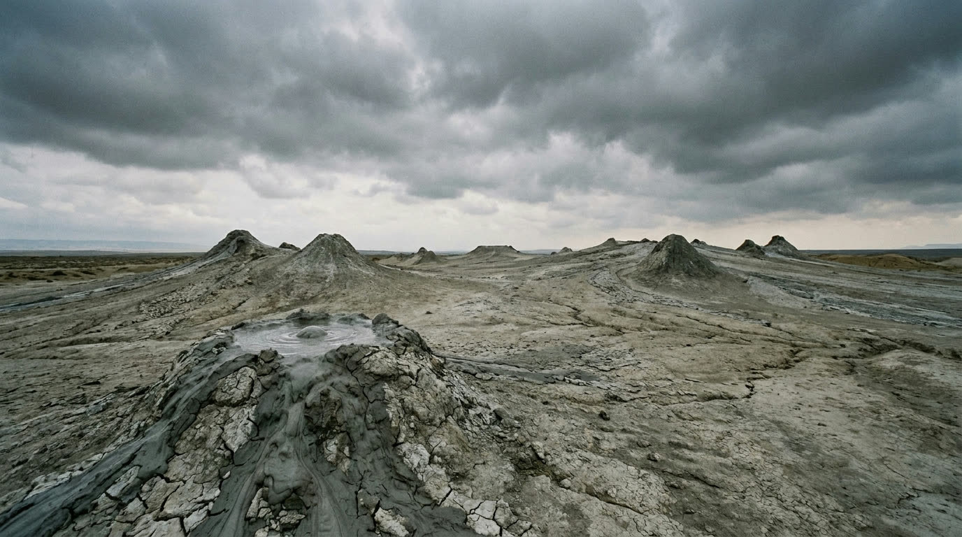 Grey mud volcano cones on the barren Gobustan plain south of Baku
