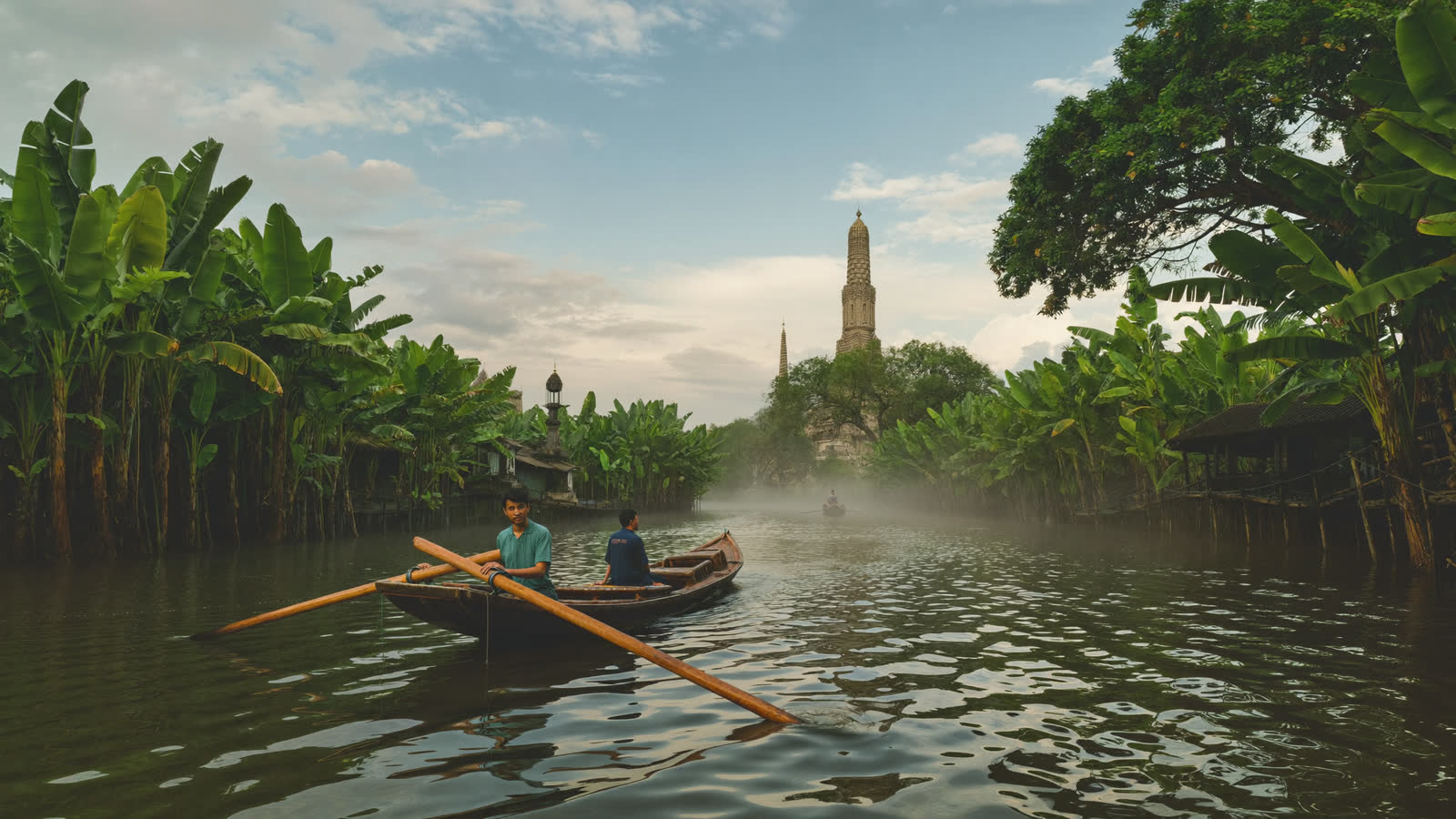 Teak long-tail boat on a Thonburi klong canal, Bangkok
