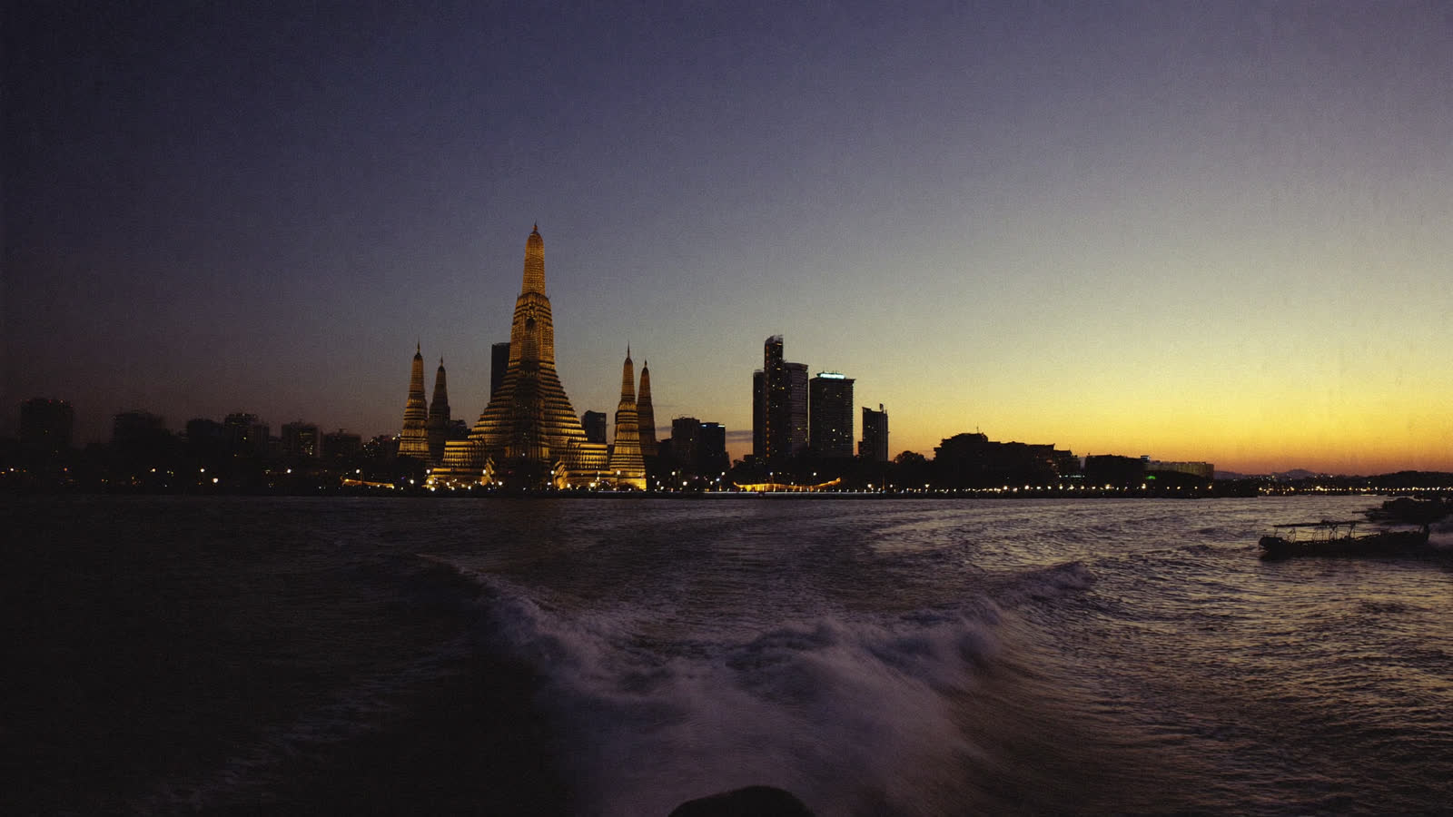Wat Arun on the Chao Phraya River at dusk, Bangkok