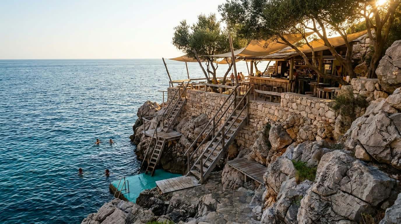 Cliff bar ledges and swimming ladders on the rocks outside Dubrovnik's sea walls