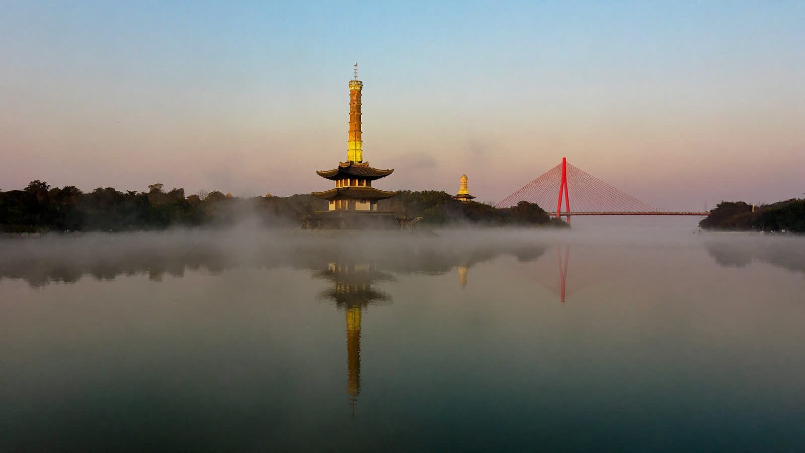 Hoan Kiem Lake at dawn with Turtle Tower in the mist, Hanoi