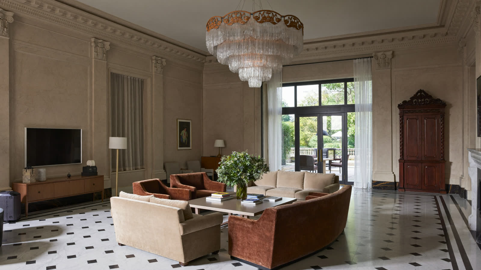 Grand art-deco hotel lobby with chandelier and chequerboard marble, London