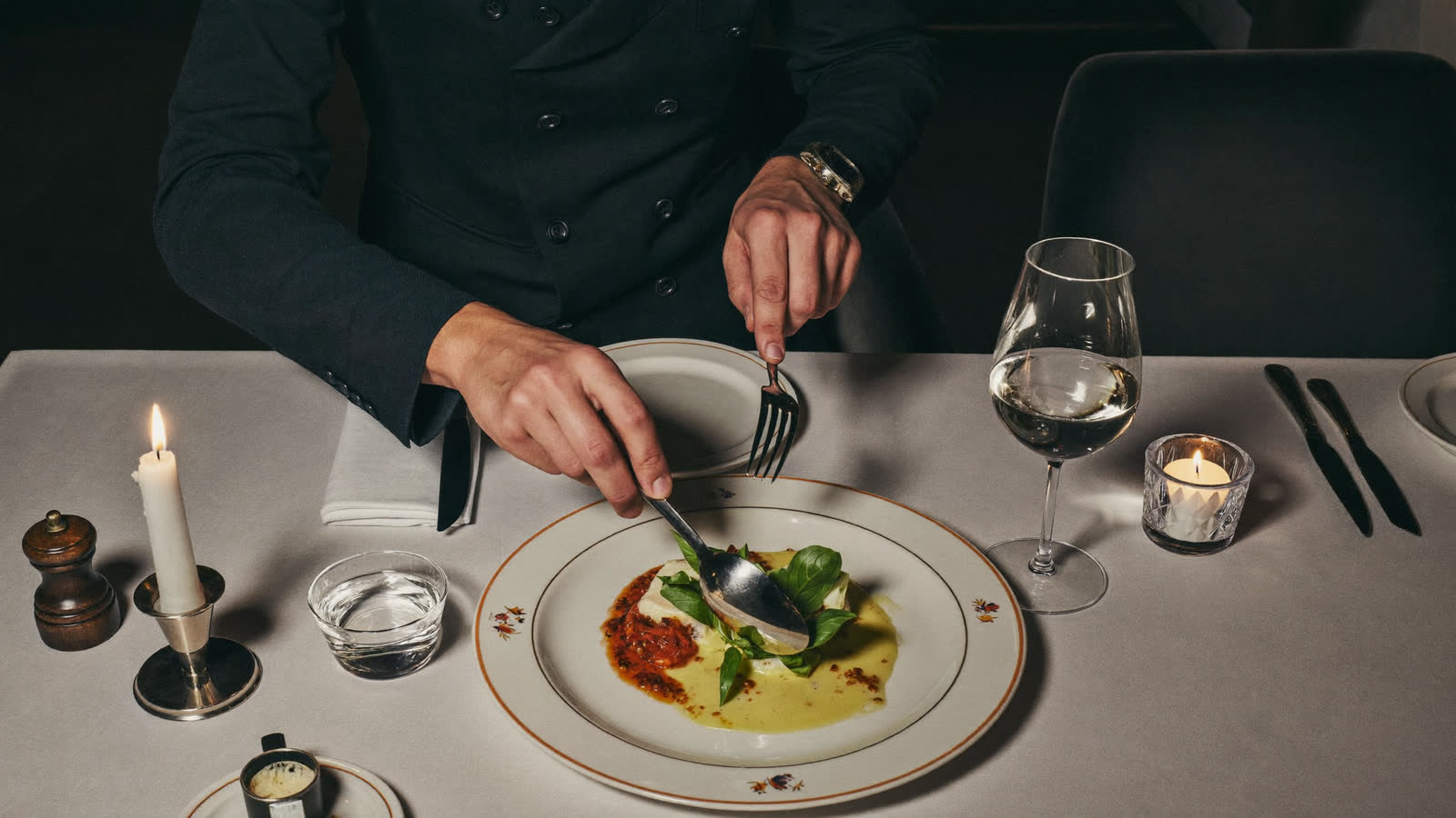 Fine-dining plate in a candlelit Michelin-starred London dining room