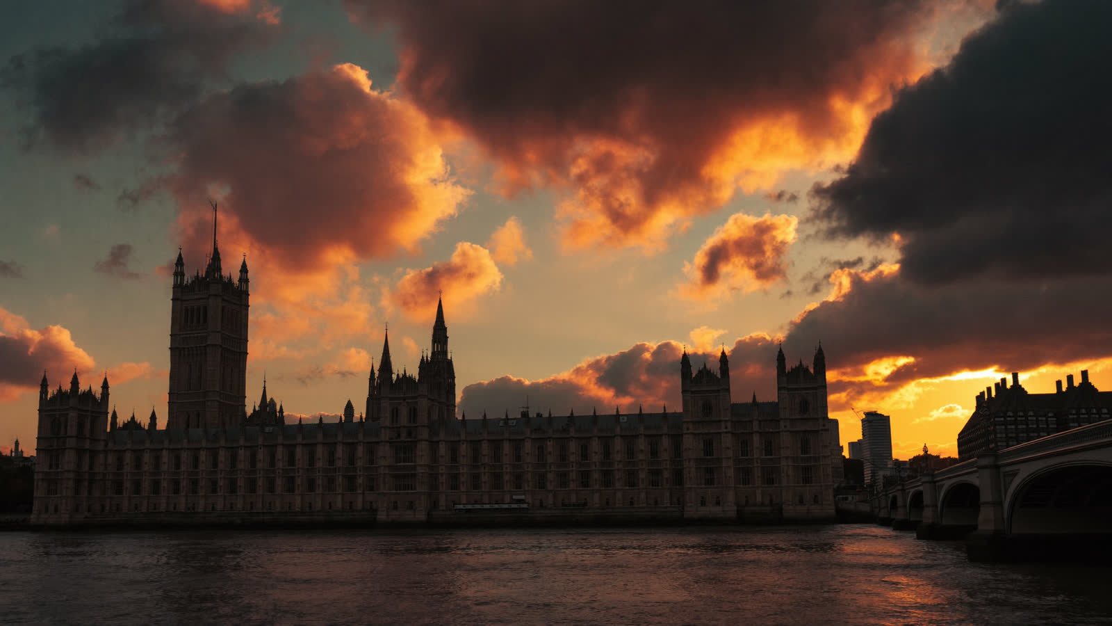 Westminster and Big Ben at golden hour from across the Thames