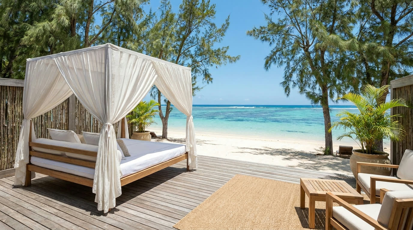 Beachfront suite terrace with daybed opening onto white sand and turquoise lagoon, Mauritius