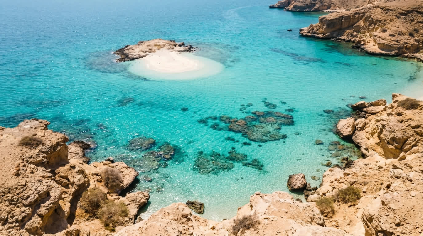 A turquoise cove and white sand islet of the Daymaniyat Islands marine reserve off Oman