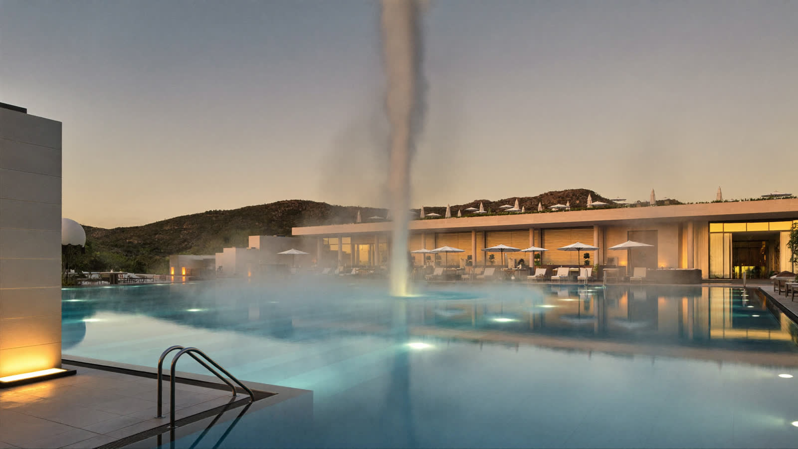 Thermal spa pool with rising steam at dusk, Pamukkale region