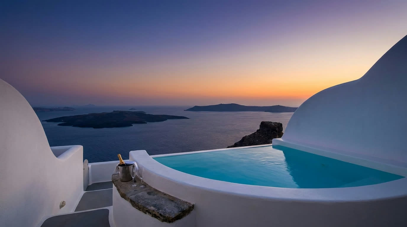 Private plunge pool on a caldera suite terrace at dusk, Santorini