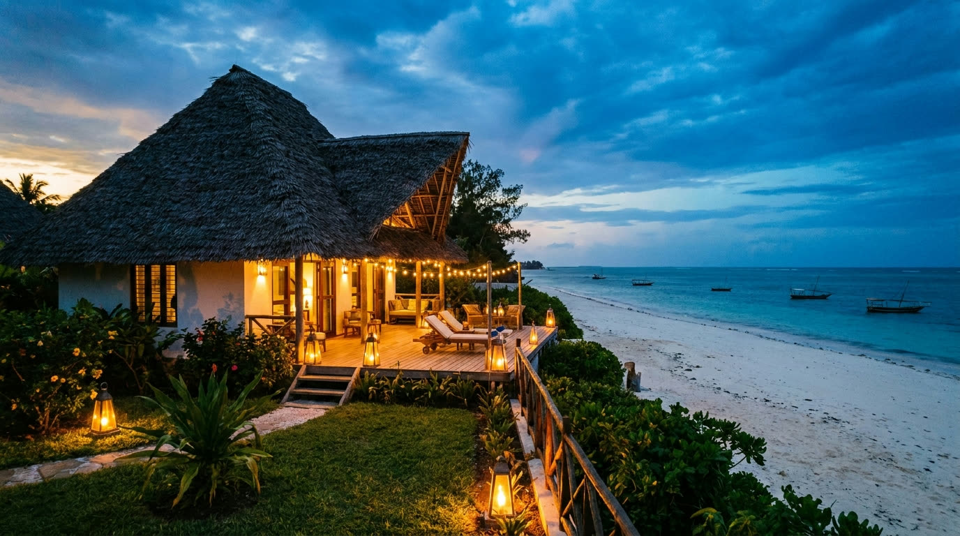 Thatched luxury beach bungalow at dusk, Zanzibar